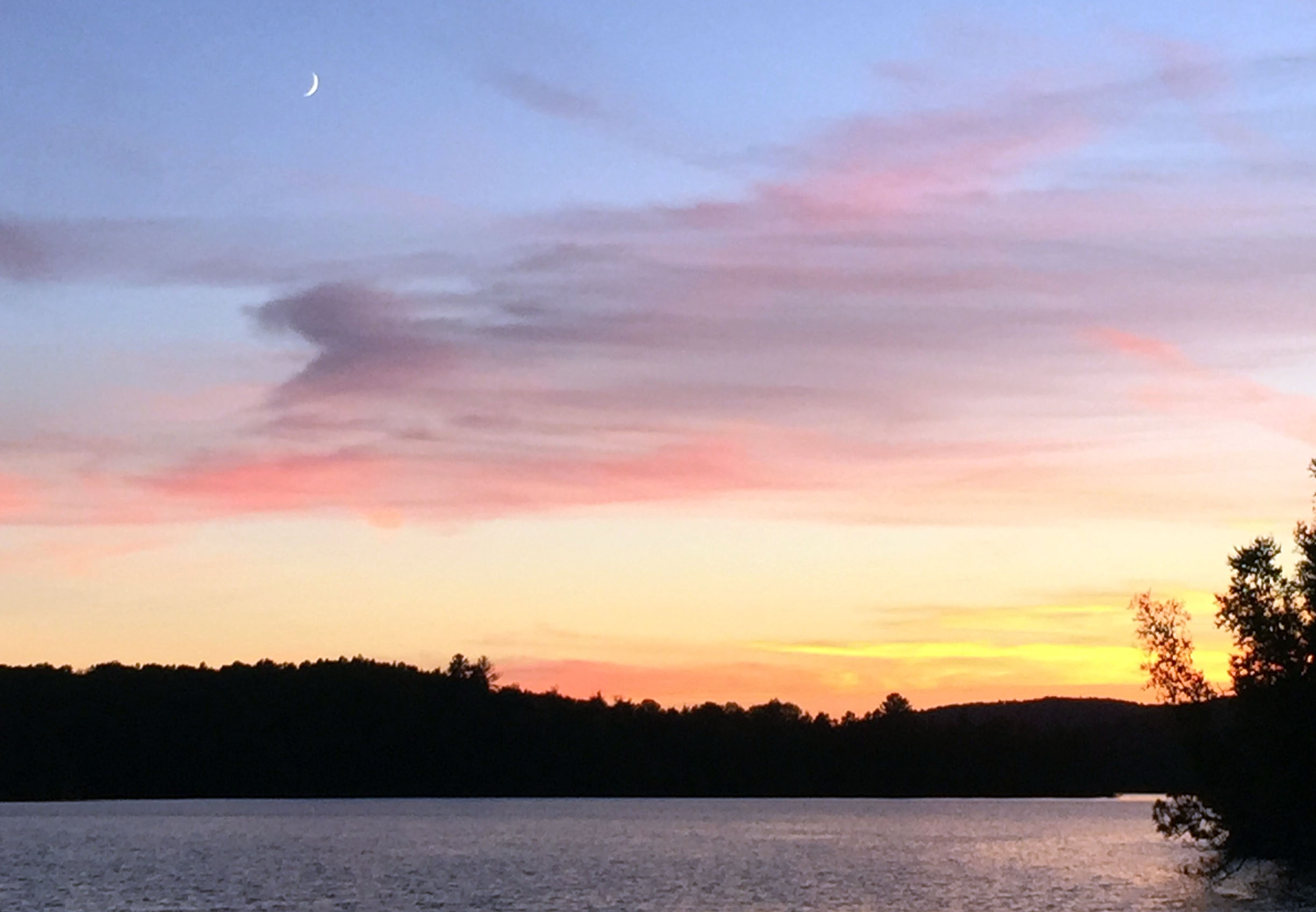Picture of the evening sky, overlooking the lake, on an island in the forest